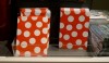 Dots on paper bags. Unlike Damien Hirst the colors here are repetitive.