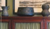 Layers Another great material mix. Here are Islamic iron bowls against rich, dark wood softened by fabric behind the doors. ( Dwellngs by Sill and Hunniford)