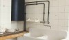 I love this kitchen sink. The walls are covered with 6 x 6 white tiles with very small grout joints.