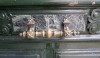Not only is the door hardware very decorative, but it is installed on a faux marble painted panel.