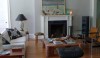 L1030662 The main living room with its traditional fireplace and a lovely assortment of mid-century classics.