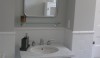 L1030669 The bathroom features all Waterworks product, simply done in classic 3 x 6 tile, a Cararra floor, a nickel washstand with a Henry fitting. Simplicity at its best.