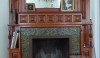 L1030700 The original chimney breast in the corner of the front room. The green tile is by the J. & G. Low tile factory of Chelsea, MA from about 1890. The luster on the tile is luminous after a good cleaning with soap and water.