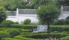 Hilltop Fancy Nestled in a boxwood bordered formal garden, this Victorian bench is right at home.