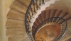 4 A dramatic staircase with simple but elegant iron railings and stone slab steps. The shape is lovely looking up at it or down from the top.