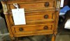 The small commode would be great in the bath. The wood could add an element of warmth against  ceramic tile or marble and the drawers are available for storage.