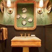 Emerald Wallpaper_AD Nov 2012 Nate Berkus was ahead of the curve when he papered this powder bath in a green overall malachite-like pattern. It is stunning with brass accents and a dark brown wainscott. This really makes a statement. (As seen in Architectural Digest November 2012.)