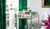 EmeraldCurtains_DecorPad-3 Emerald green window treatments and a touch of green glass on the bar cart is a bold but refreshing statement. (As seen on DecorPad.)