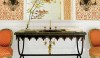 124834220890985987_Upd7ZFTC_c The small pattern of the wallpaper makes the wall feel like a solid color. The black and white with the tangerine and brass fittings make the space feel fresh.