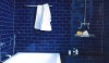 Cobalt Blue Bathroom A great deep blue bath tiled from floor to ceiling creates a memorable space. The crisp white floor tile anchors the bath and ties back to the white fixtures.