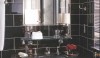 Nate Berkus Black WW bathroom I am glad to see that Nate Berkus loves tile as much as I do. He installed a large scale glossy black ceramic tile with a lighter grout color installed floor to ceiling. The installation feels urban and sophisticated.