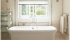 Waterworks Tub This is one of my favorite tiled bathrooms. The space is clad floor to ceiling with just the smallest detail of different size liners. Creamy white and watery green, classic and traditional but with a timeless freshness.