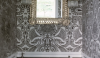 aabe9135f4e7 The black wainscot and paisley-like wall pattern is a good fit with the decorative lights and mirror.