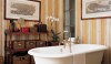 edc-striped-wallpaper-bath-laura-sartori-rimini-roberto-peregalli-0408-lgn I've shown this image before, but I like the strength of the stripes and the dark floor that picks up its color from the walls. It is traditional but updated.