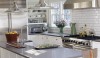 kitchen-tile-backsplash1 Crisp white tile for a kitchen backsplash is always in style. This one has been installed with a gray grout which accents the grid.