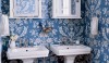 tumblr_lkojvpGRJX1qf61xdo1_400 A crisp blue and white space with a very traditional wallpaper and a stenciled floor. This is a very bold statement in what appears to be a small space.