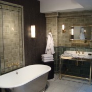 District Tile is inset into Moleskin marble to create panels. The glazes of District Tile are rich with dark pooling while the decoration is created by changing the grid pattern.