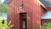 McAlpine Tankersley create the most inviting doorways. This informal entrance protrudes out to encourage you to enter. The red paint adds to the informality of the structure.