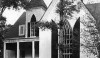 This is a fabulous updated take on a Gothic style house. The shutters are great.
