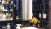 A masculine bath using dark tile to make a dramatic statement.
