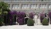 L1040160 The courtyard at the church with violet colored bougainvillea. The color is a lovely contrast to the cream colored stone.