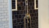 RW Atlas 58th St Exposed District Tile, color ink, with a light gray grout.