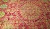 image (9) Geometric patterns are woven in silk in this colorful ancient rug.
