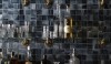 kitch and bar_repose dark tile light grout The surface of the glass is very active and the choice of grout to match the lighter tones gives the backsplash a more holistic look.